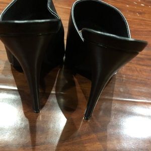 Black pointed high heeled mules